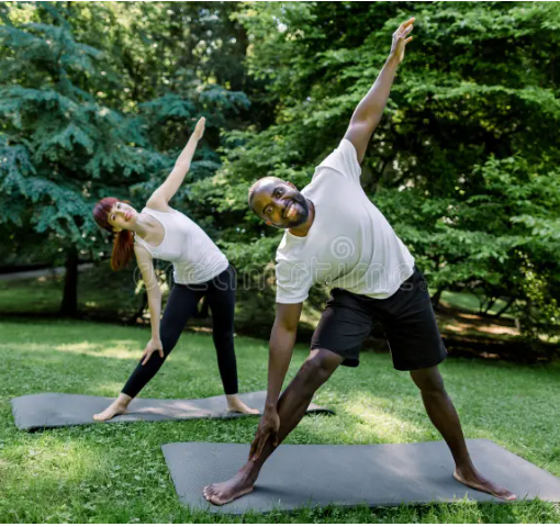 Men and Women practising Yoga